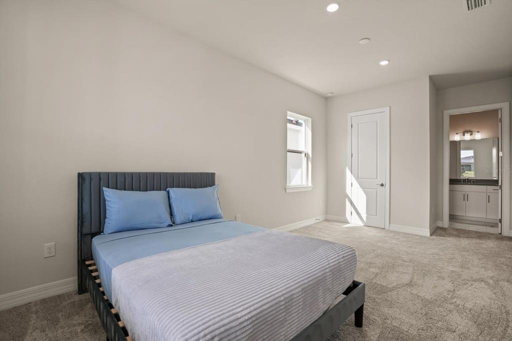 8352 Pk Clf Way Orlando, FL 32836 - Photo 21 of 55 a bedroom with a bed and a window