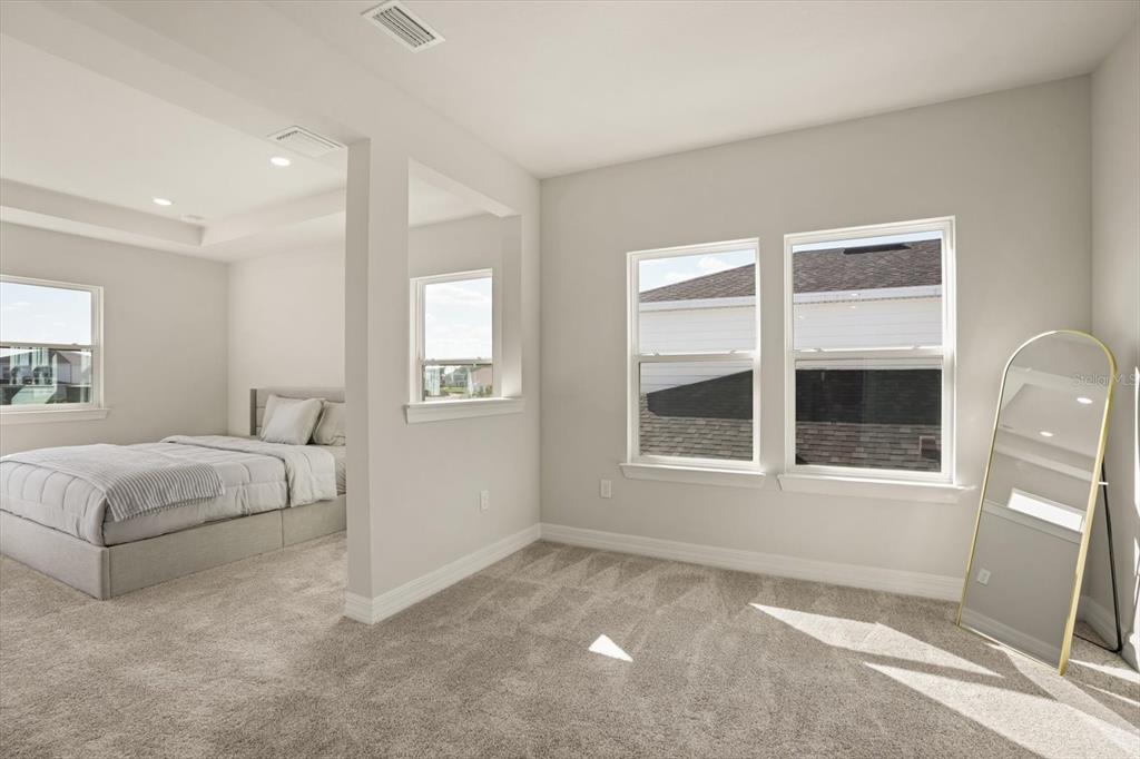 8352 Pk Clf Way Orlando, FL 32836 - Photo 26 of 55 a spacious bedroom with a bed and a large window