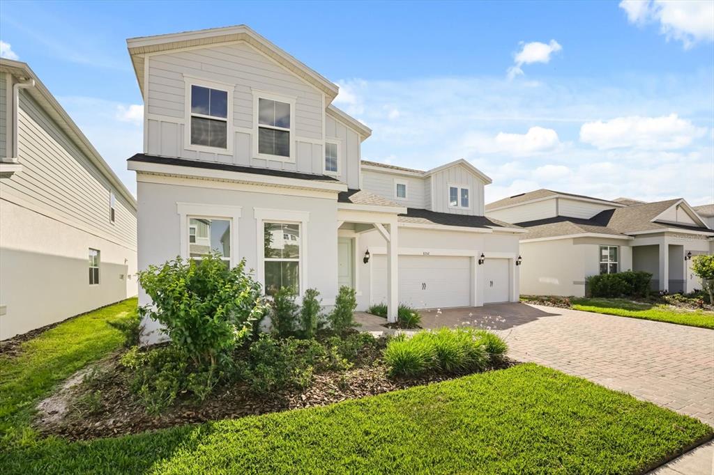 8352 Pk Clf Way Orlando, FL 32836 - Photo 3 of 55 a front view of a house with a yard and garage