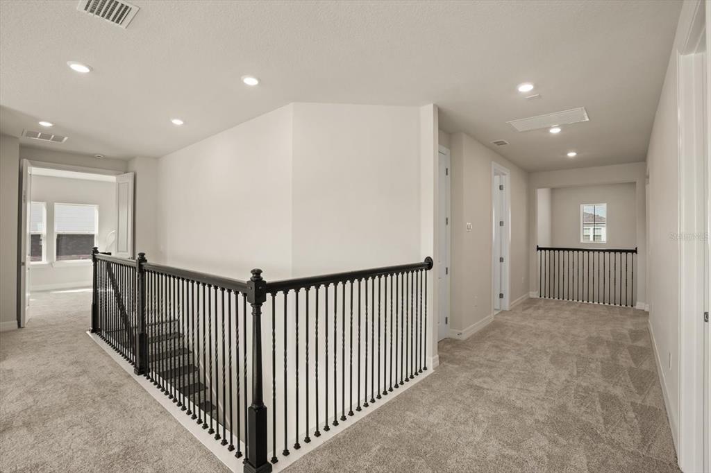 8352 Pk Clf Way Orlando, FL 32836 - Photo 31 of 55 a view of a hallway with windows and stairs