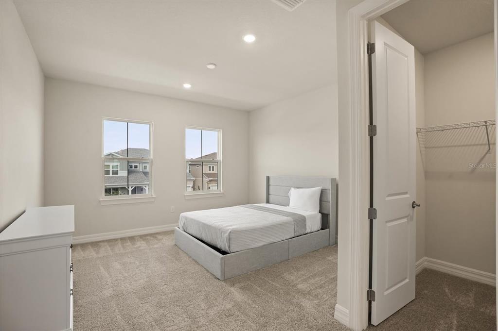 8352 Pk Clf Way Orlando, FL 32836 - Photo 37 of 55 a spacious bedroom with a bed and a window