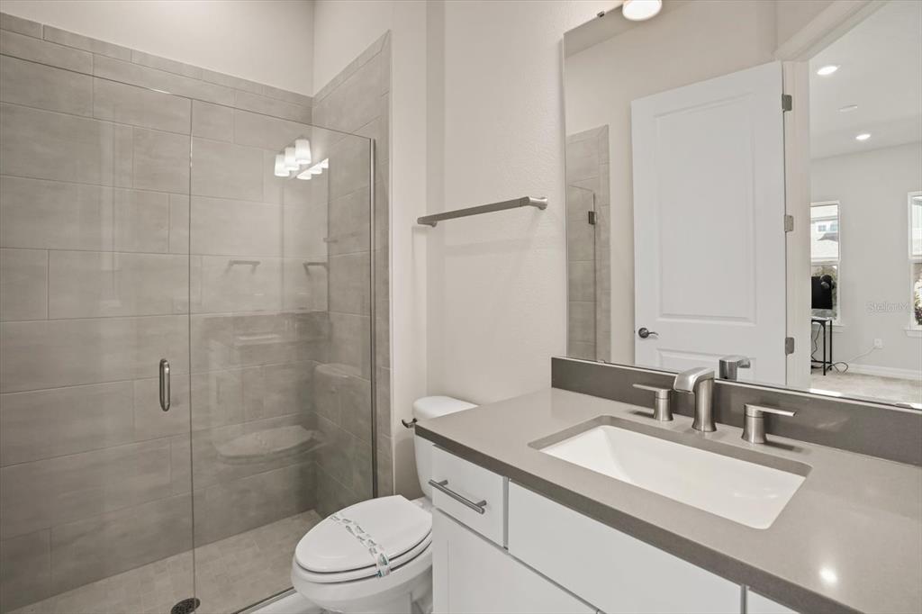 8352 Pk Clf Way Orlando, FL 32836 - Photo 40 of 55 a bathroom with a sink a toilet and shower