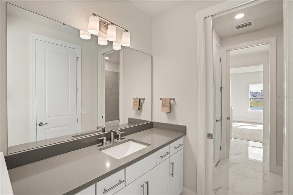 8352 Pk Clf Way Orlando, FL 32836 - Photo 46 of 55 a bathroom with a sink and a mirror