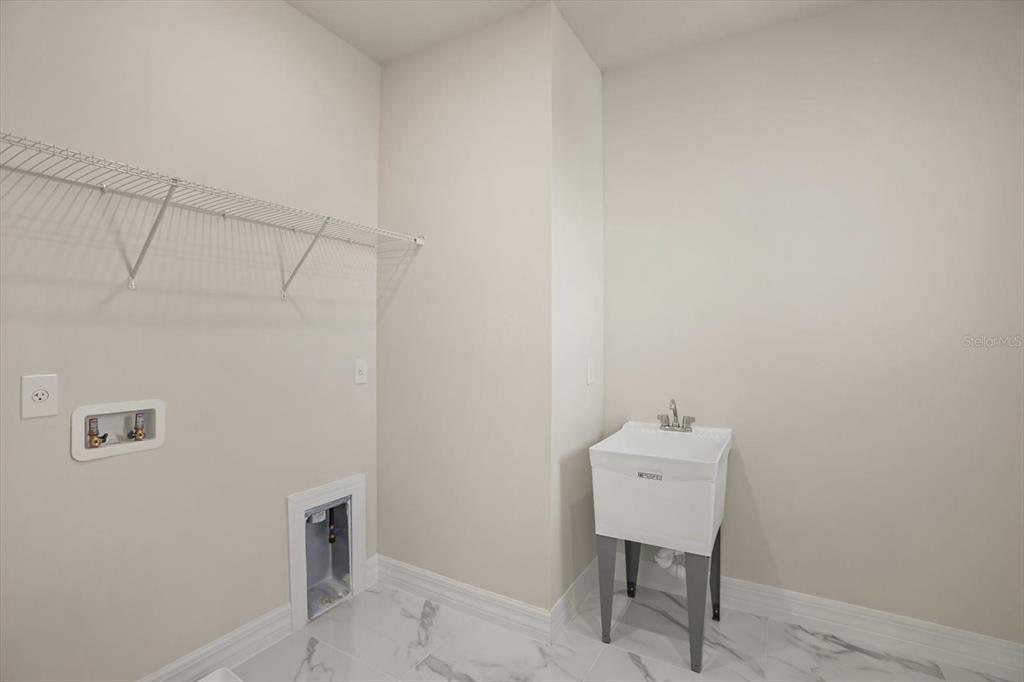 8352 Pk Clf Way Orlando, FL 32836 - Photo 48 of 55 a bathroom with a sink and a mirror