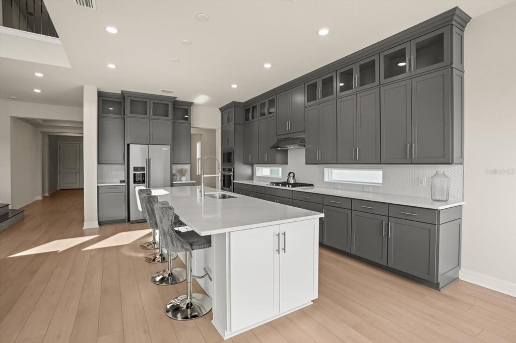 8352 Pk Clf Way Orlando, FL 32836 - Photo 10 of 55 a kitchen with a sink appliances and cabinets