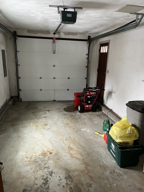 38 Chevy Chase Road Worcester, MA 01606 - Photo 12 of 35 a room with water heater and wooden cabinets