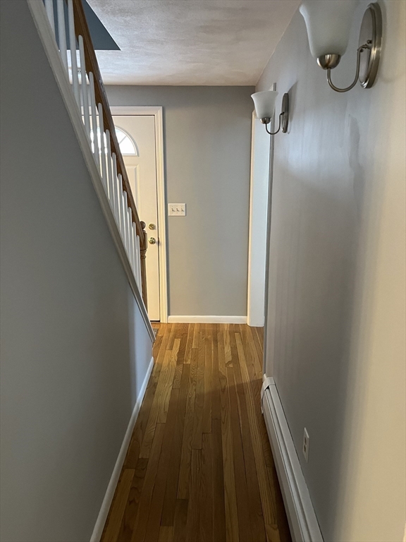 38 Chevy Chase Road Worcester, MA 01606 - Photo 15 of 35 a view of a hallway with wooden floor and staircase