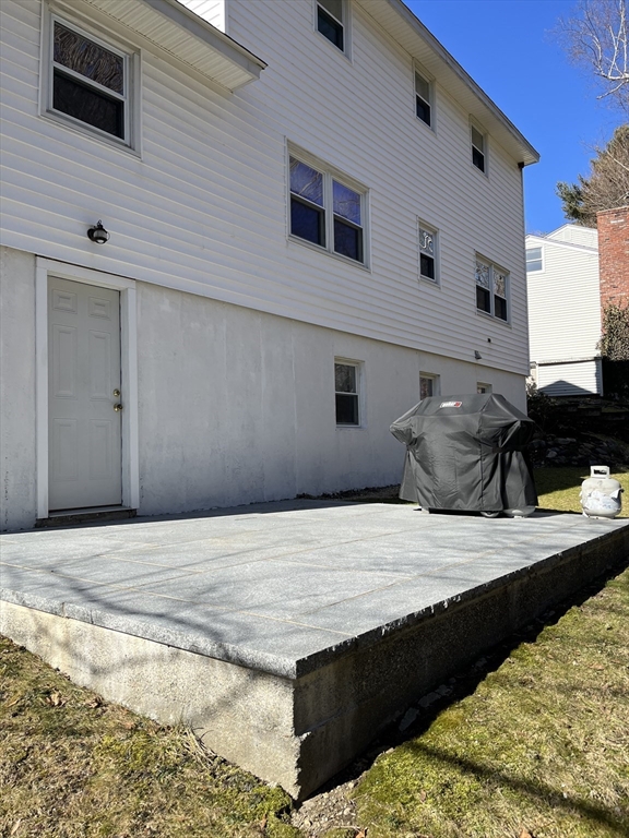 38 Chevy Chase Road Worcester, MA 01606 - Photo 35 of 35 a bathroom with a granite countertop sink and washing machine