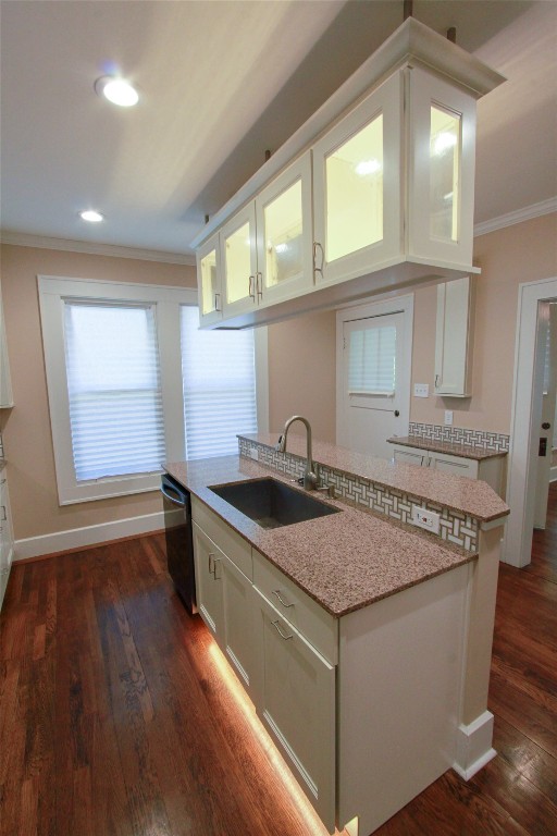 1301 South 6th Street Austin, TX 78704 - Photo 11 of 35 a kitchen that has a sink a stove and a wooden floor