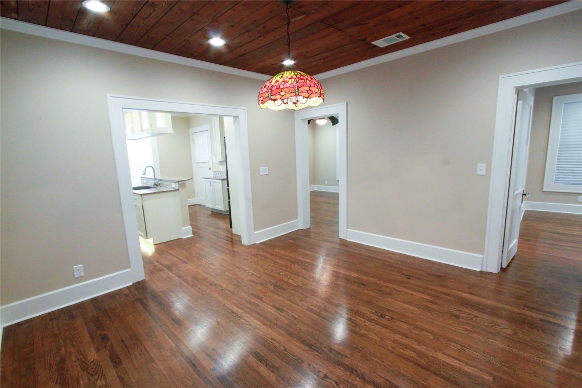 1301 South 6th Street Austin, TX 78704 - Photo 15 of 35 a view of an empty room with window and wooden floor