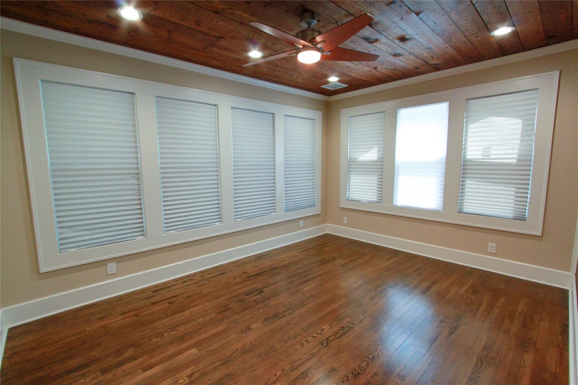 1301 South 6th Street Austin, TX 78704 - Photo 18 of 35 a view of an empty room with wooden floor and a window
