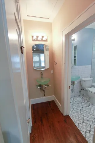 a bathroom with a sink and mirror