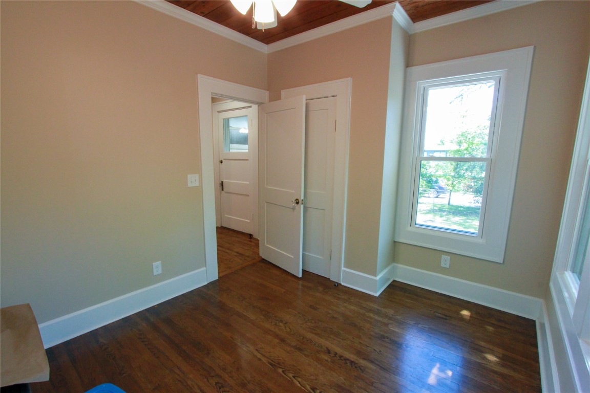 1301 South 6th Street Austin, TX 78704 - Photo 25 of 35 an empty room with wooden floor and windows
