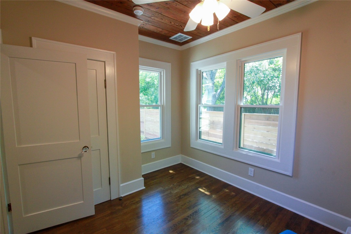 1301 South 6th Street Austin, TX 78704 - Photo 26 of 35 a view of an empty room with wooden floor and a window