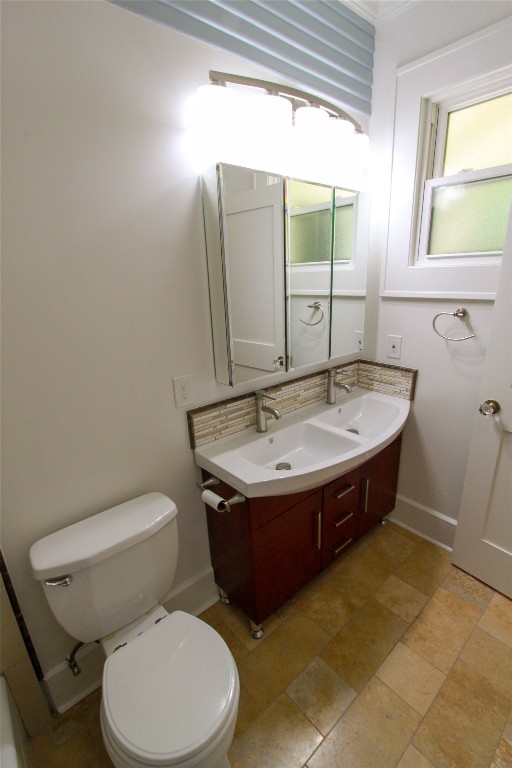1301 South 6th Street Austin, TX 78704 - Photo 27 of 35 a bathroom with a sink and a toilet