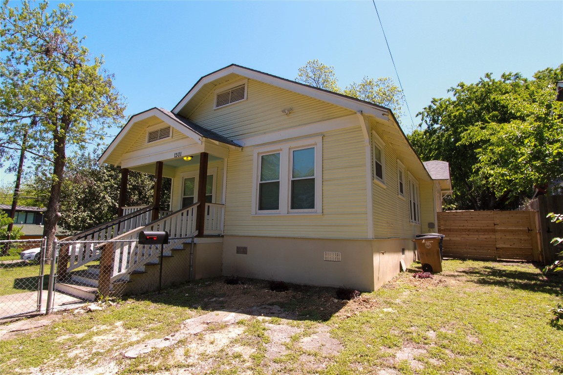 1301 South 6th Street Austin, TX 78704 - Photo 4 of 35 a front view of a house with a yard