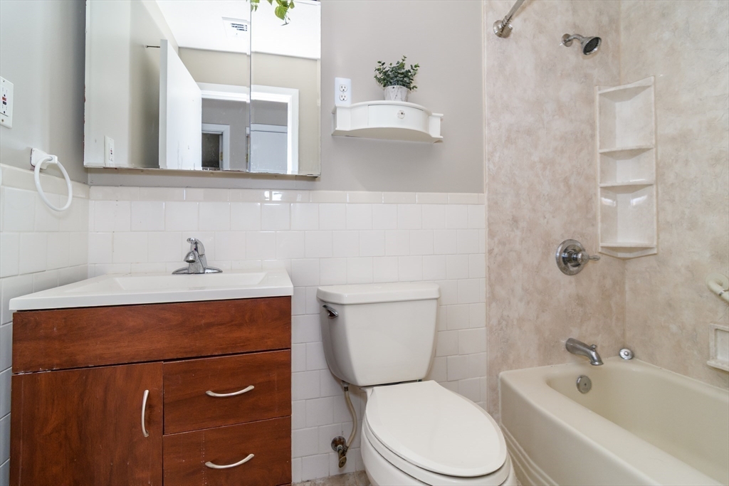 3 Hickory Lane, Unit 3 Framingham, MA 01701 - Photo 15 of 24 a bathroom with a sink a toilet and shower