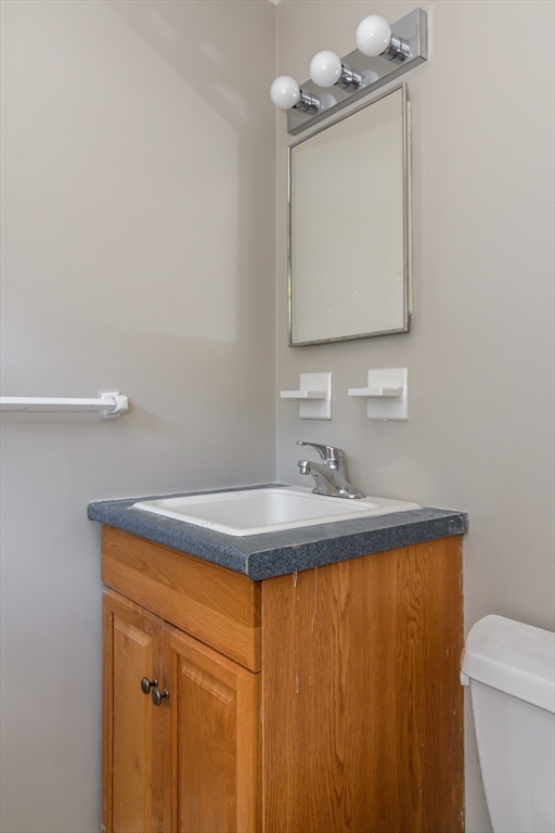 3 Hickory Lane, Unit 3 Framingham, MA 01701 - Photo 21 of 24 a bathroom with a sink a toilet and mirror