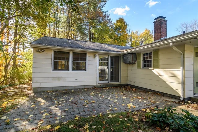 a house with trees in the background