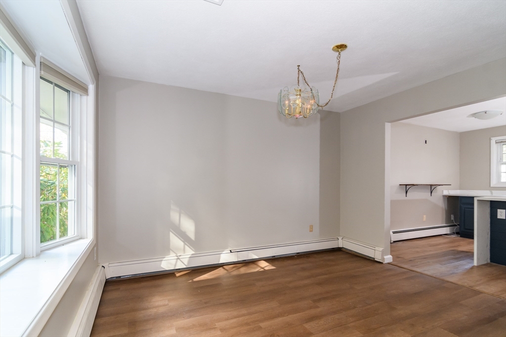 3 Hickory Lane, Unit 3 Framingham, MA 01701 - Photo 7 of 24 a view of an empty room with wooden floor and a window