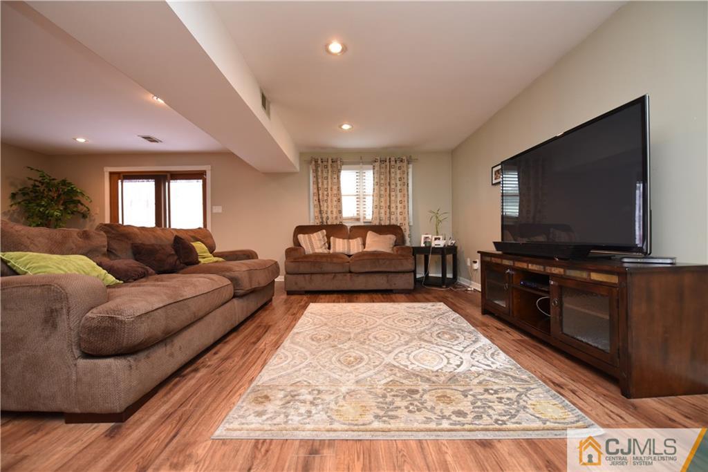 15 Dumas Road Old Bridge, NJ 08857 - Photo 2 of 15 a living room with furniture and a flat screen tv