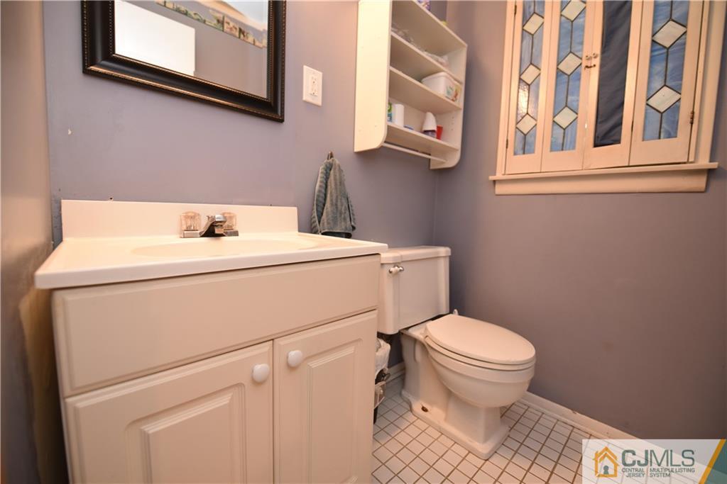 15 Dumas Road Old Bridge, NJ 08857 - Photo 11 of 15 a bathroom with a sink toilet and a mirror
