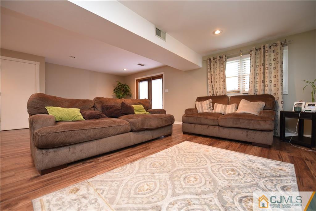 15 Dumas Road Old Bridge, NJ 08857 - Photo 3 of 15 a living room with furniture and a rug