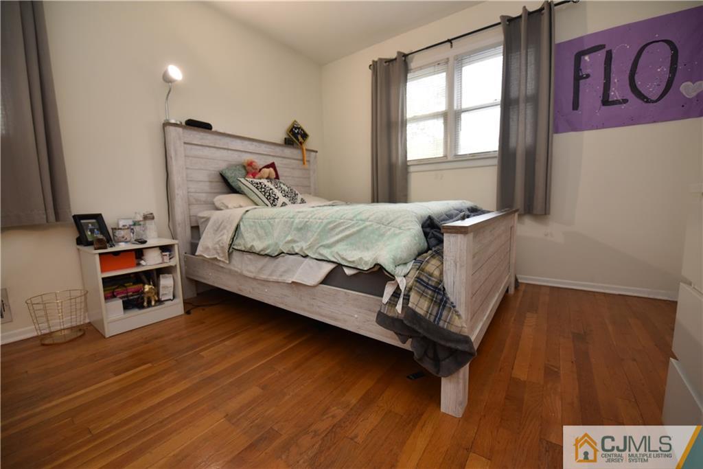 15 Dumas Road Old Bridge, NJ 08857 - Photo 8 of 15 a bed sitting in a bedroom next to a window