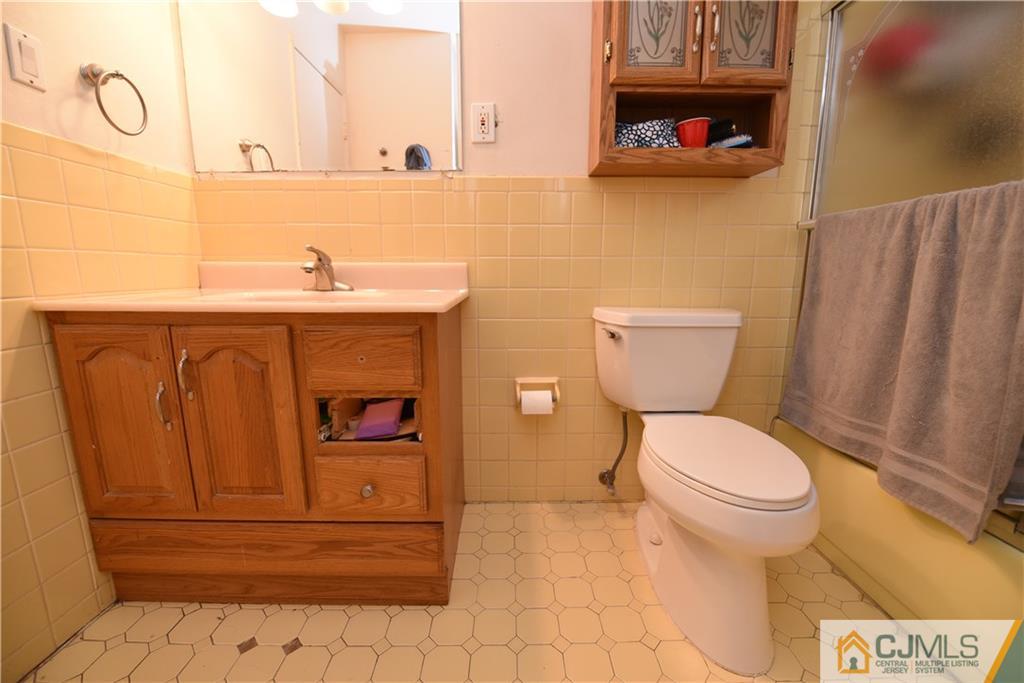 15 Dumas Road Old Bridge, NJ 08857 - Photo 9 of 15 a bathroom with a toilet and a sink