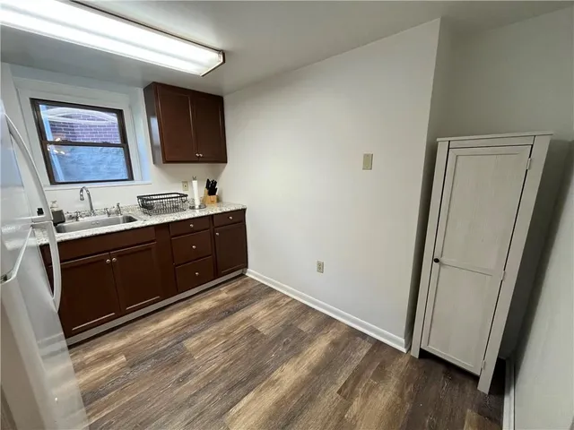a bathroom with a vanity a mirror and a sink