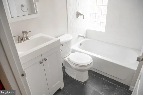 a view of bathroom with bathtub and shower