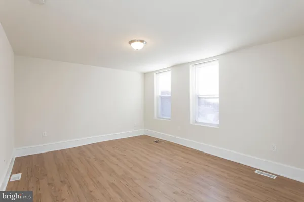 a kitchen with stainless steel appliances granite countertop a stove a refrigerator and a microwave