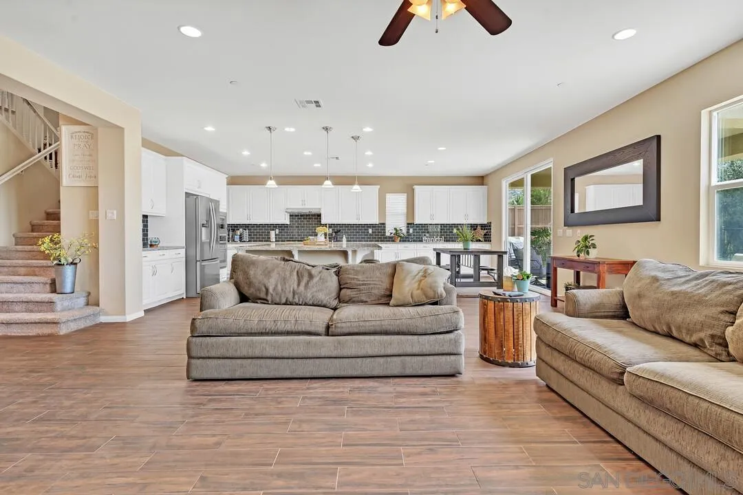 10057 Ranchitos Place Lakeside, CA 92040 - Photo 11 of 45 a living room with furniture and a view of kitchen