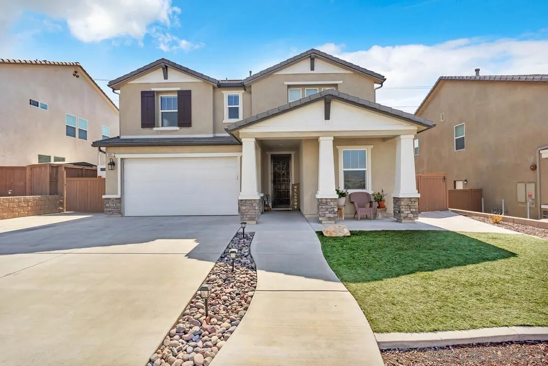 10057 Ranchitos Place Lakeside, CA 92040 - Photo 2 of 45 a front view of a house with garden