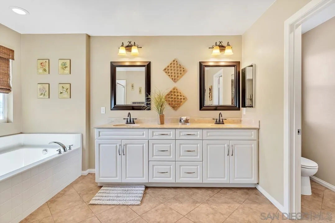10057 Ranchitos Place Lakeside, CA 92040 - Photo 23 of 45 a spacious bathroom with a double vanity sink double mirror and bathtub