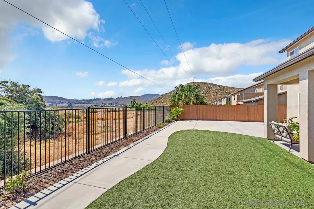 10057 Ranchitos Place Lakeside, CA 92040 - Photo 36 of 45 a view of a pathway with a wrought fence