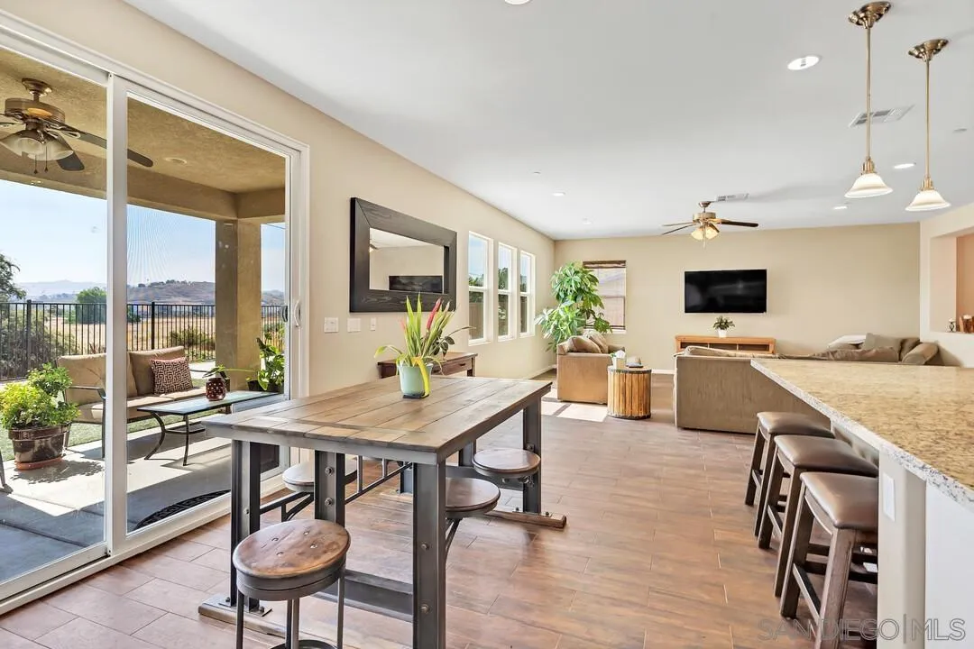 10057 Ranchitos Place Lakeside, CA 92040 - Photo 7 of 45 a view of a dining room with furniture window and wooden floor