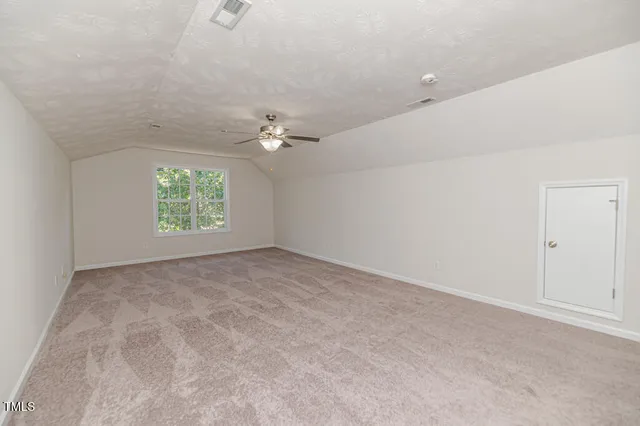 a view of a hallway with a white door
