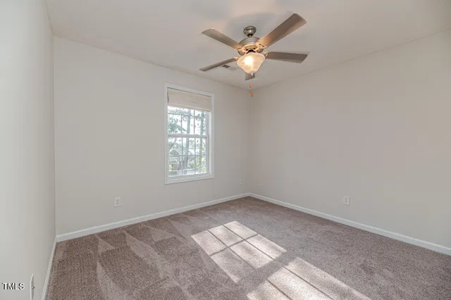 a view of a hallway with windows and entryway