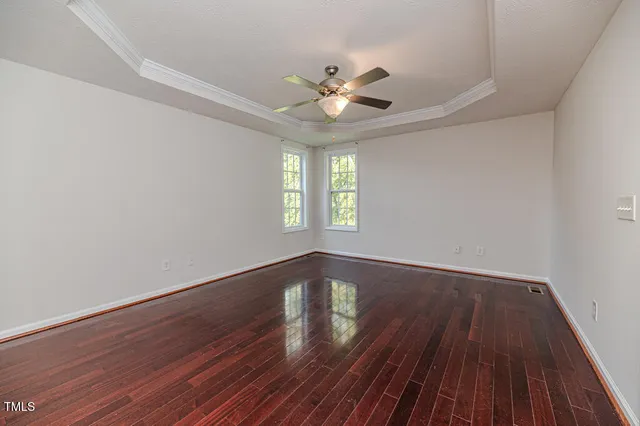 a bathroom with a toilet and a mirror