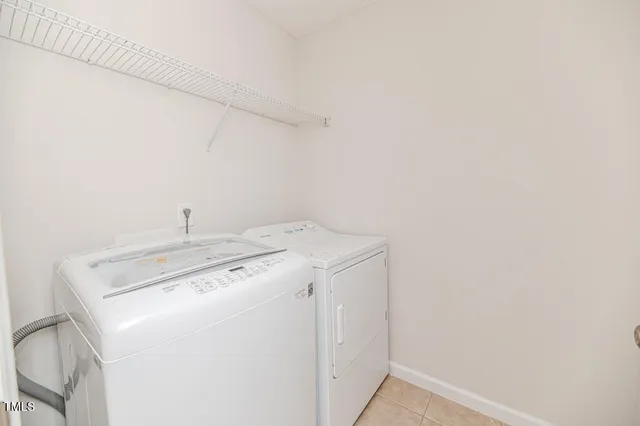 a large kitchen with a cabinets and stainless steel appliances