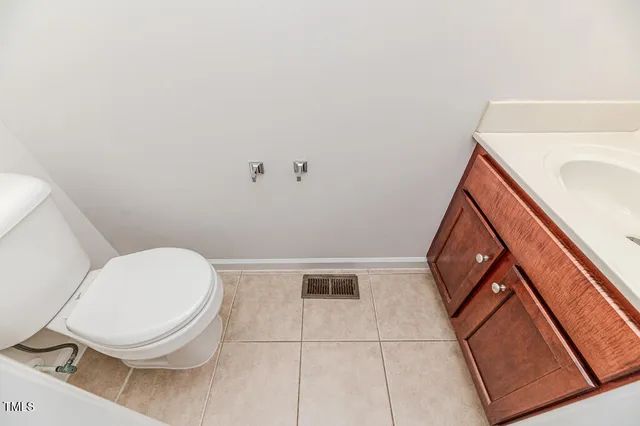 a large room with a large window and kitchen view