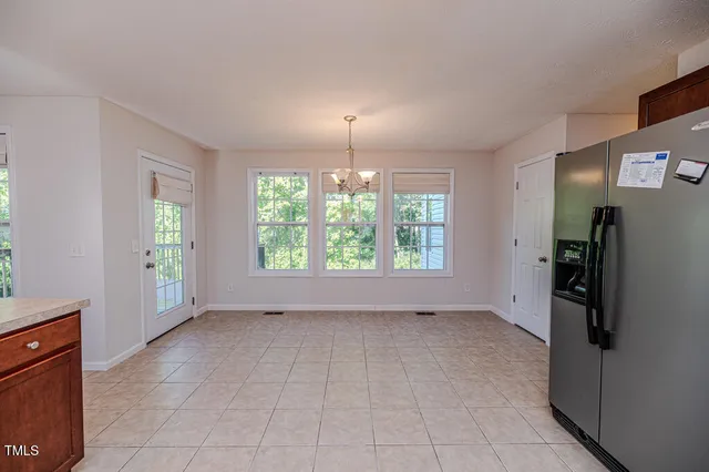 a kitchen with stainless steel appliances granite countertop wooden cabinets a sink and dishwasher