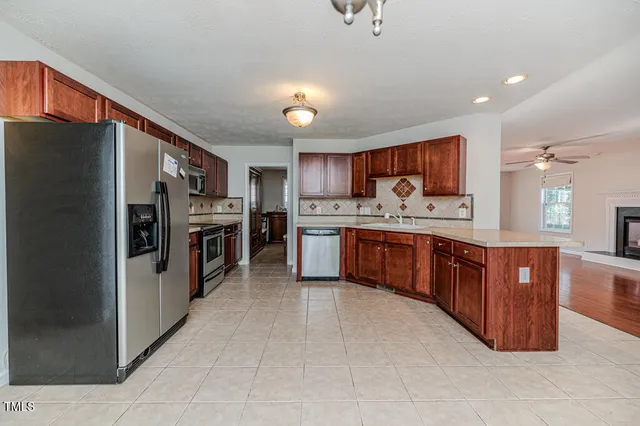 wooden floor in an empty room with a fireplace