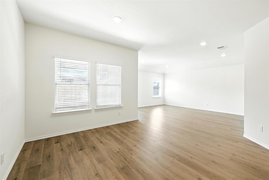 2808 Jasmine Drive Sherman, TX 75092 - Photo 14 of 38 an empty room with wooden floor and windows