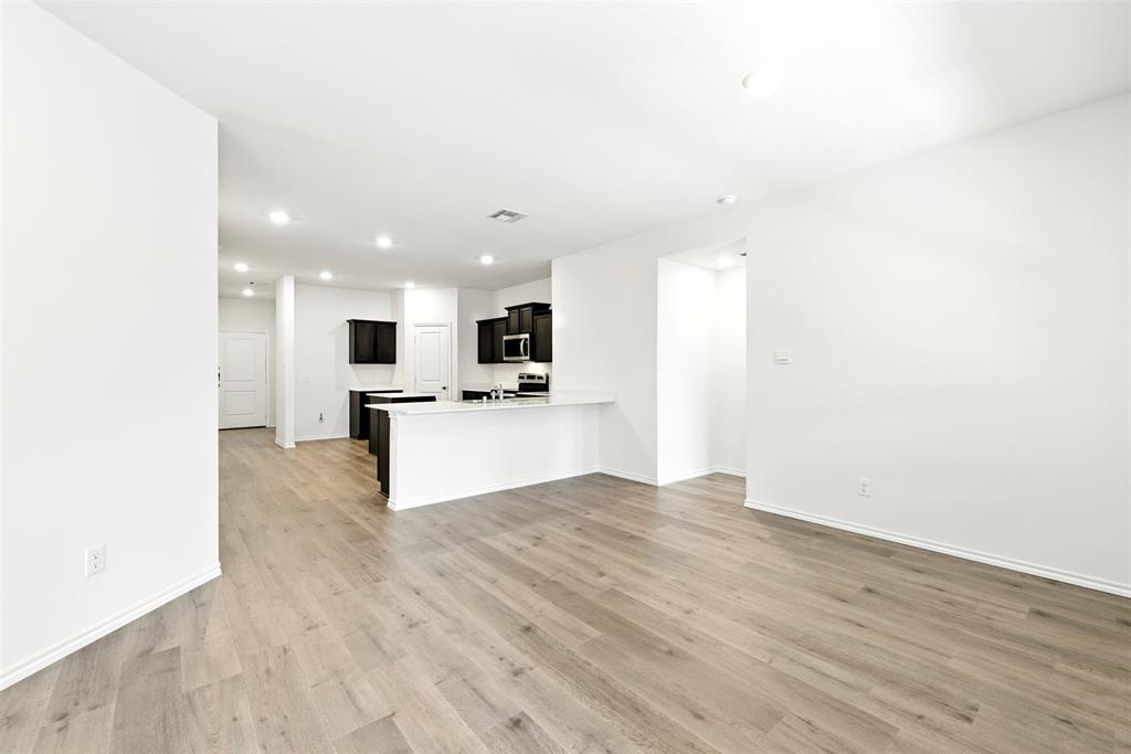 2808 Jasmine Drive Sherman, TX 75092 - Photo 16 of 38 a view of kitchen with granite countertop cabinets and refrigerator