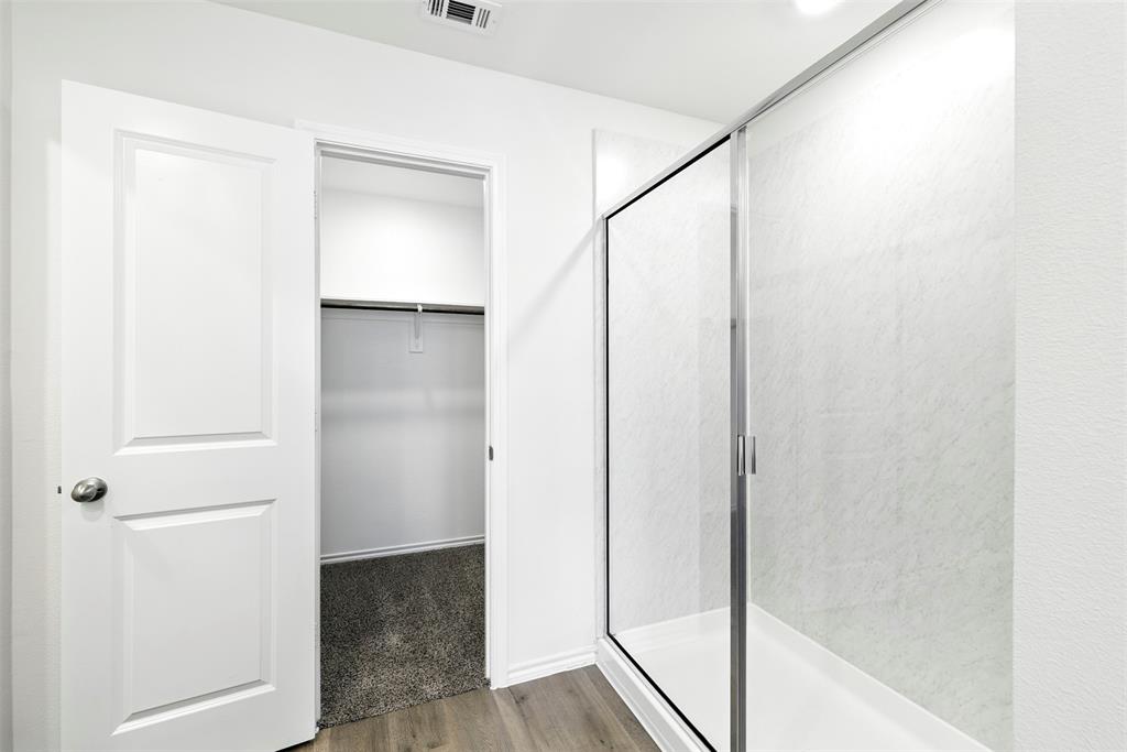 2808 Jasmine Drive Sherman, TX 75092 - Photo 22 of 38 a bathroom with a shower and a glass door