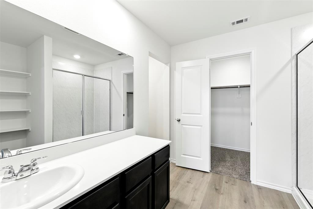 2808 Jasmine Drive Sherman, TX 75092 - Photo 23 of 38 a spacious bathroom with a granite countertop sink and a mirror