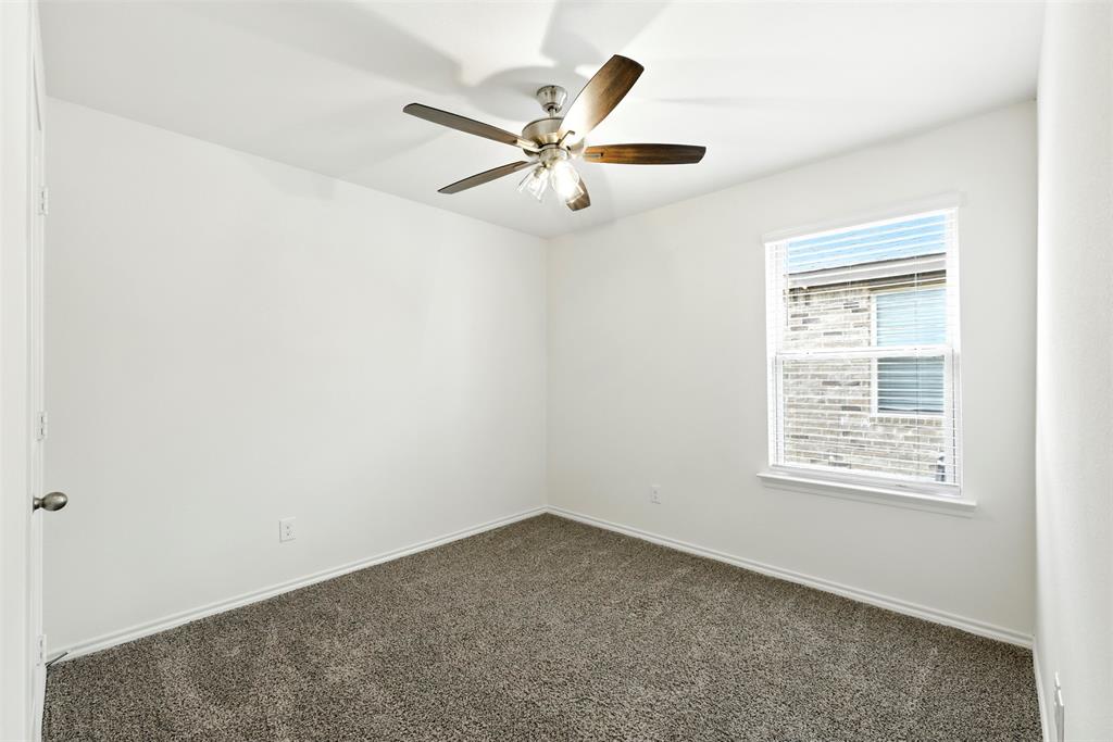 2808 Jasmine Drive Sherman, TX 75092 - Photo 24 of 38 an empty room with a window and a fan