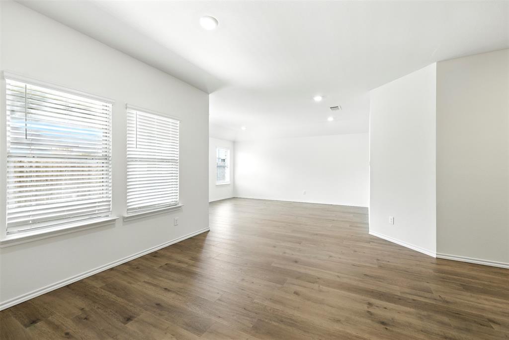 2808 Jasmine Drive Sherman, TX 75092 - Photo 25 of 38 an empty room with wooden floor and windows